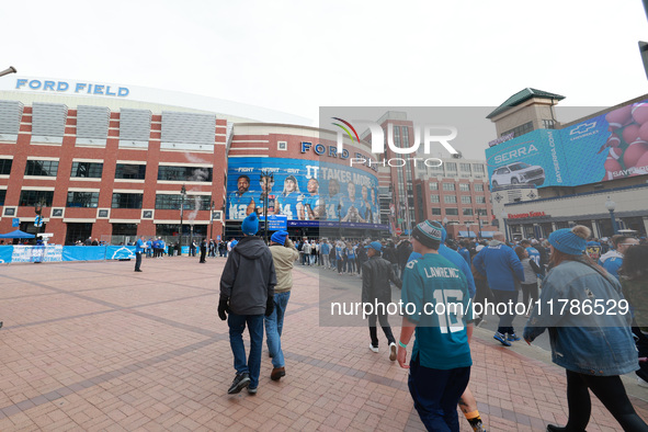 DETROIT,MICHIGAN-November 17: Fans arrive at Ford Field prior to the NFL football game between the Jacksonville Jaguars and the Detroit Lion...