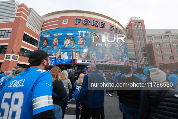 DETROIT,MICHIGAN-November 17: Fans arrive at Ford Field prior to the NFL football game between the Jacksonville Jaguars and the Detroit Lion...