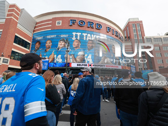 DETROIT,MICHIGAN-November 17: Fans arrive at Ford Field prior to the NFL football game between the Jacksonville Jaguars and the Detroit Lion...