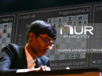 Indian GM R Praggnanandhaa plays chess during the 6th TATA Steel Chess India Tournament at Dhono Dhanyo Auditorium in Kolkata, India, on Nov...