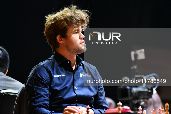 Norwegian GM Magnus Carlsen plays chess during the 6th TATA Steel Chess India Tournament at Dhono Dhanyo Auditorium in Kolkata, India, on No...