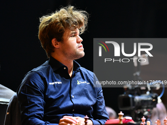 Norwegian GM Magnus Carlsen plays chess during the 6th TATA Steel Chess India Tournament at Dhono Dhanyo Auditorium in Kolkata, India, on No...