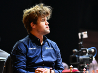 Norwegian GM Magnus Carlsen plays chess during the 6th TATA Steel Chess India Tournament at Dhono Dhanyo Auditorium in Kolkata, India, on No...