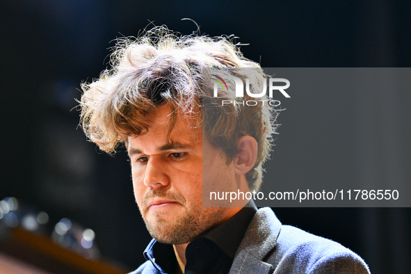 Norwegian GM Magnus Carlsen plays chess during the 6th TATA Steel Chess India Tournament at Dhono Dhanyo Auditorium in Kolkata, India, on No...