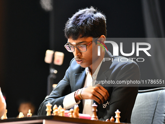 Indian GM R Praggnanandhaa plays chess during the 6th TATA Steel Chess India Tournament at Dhono Dhanyo Auditorium in Kolkata, India, on Nov...