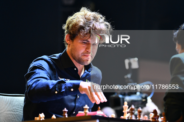 Norwegian GM Magnus Carlsen plays chess during the 6th TATA Steel Chess India Tournament at Dhono Dhanyo Auditorium in Kolkata, India, on No...