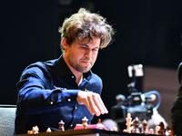 Norwegian GM Magnus Carlsen plays chess during the 6th TATA Steel Chess India Tournament at Dhono Dhanyo Auditorium in Kolkata, India, on No...