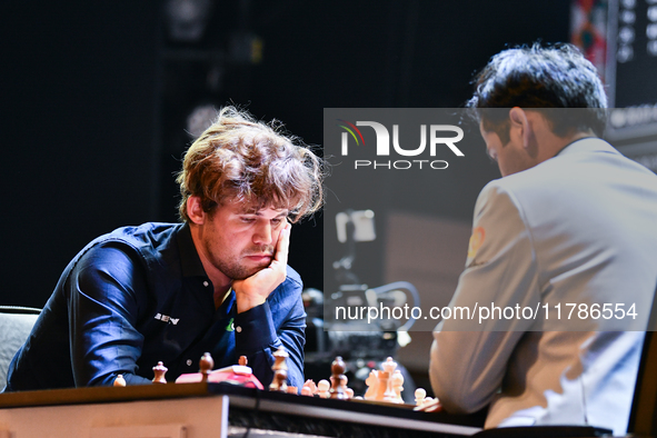 Norway's GM Magnus Carlsen plays Blitz round chess against Indian GM Arjun Erigaisi during the 6th TATA Steel Chess India Tournament at Dhon...