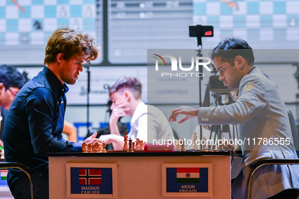 Norway's GM Magnus Carlsen plays Blitz round chess against Indian GM Arjun Erigaisi during the 6th TATA Steel Chess India Tournament at Dhon...