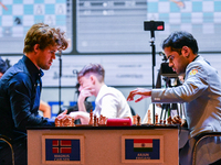 Norway's GM Magnus Carlsen plays Blitz round chess against Indian GM Arjun Erigaisi during the 6th TATA Steel Chess India Tournament at Dhon...