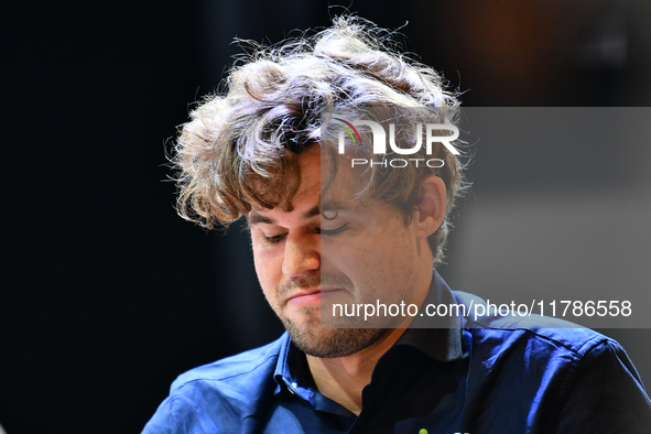 Norwegian GM Magnus Carlsen plays chess during the 6th TATA Steel Chess India Tournament at Dhono Dhanyo Auditorium in Kolkata, India, on No...