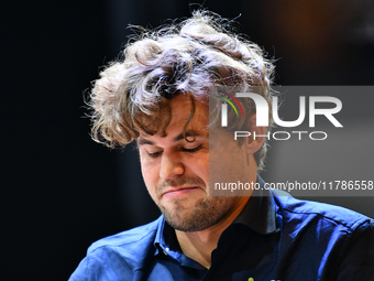 Norwegian GM Magnus Carlsen plays chess during the 6th TATA Steel Chess India Tournament at Dhono Dhanyo Auditorium in Kolkata, India, on No...