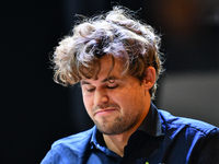 Norwegian GM Magnus Carlsen plays chess during the 6th TATA Steel Chess India Tournament at Dhono Dhanyo Auditorium in Kolkata, India, on No...