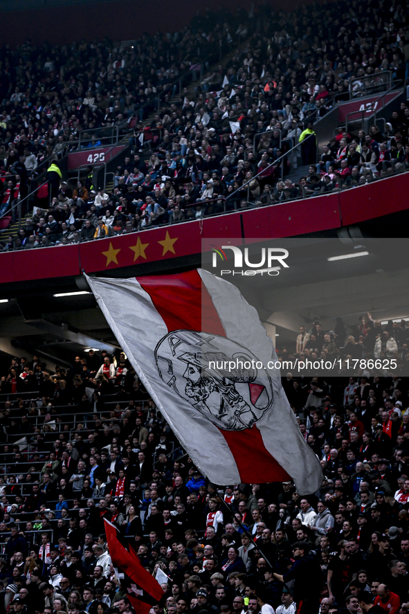 Fans of Ajax hold a flag with the old logo of Ajax during the match between Ajax Legends and Real Madrid Legends at the Johan Cruijff ArenA...