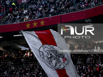 Fans of Ajax hold a flag with the old logo of Ajax during the match between Ajax Legends and Real Madrid Legends at the Johan Cruijff ArenA...