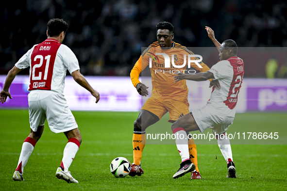 Real Madrid CF legend Clarence Seedorf and AFC Ajax Amsterdam legend Eyong Enoh participate in the match between Ajax Legends and Real Madri...