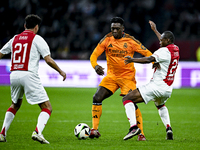 Real Madrid CF legend Clarence Seedorf and AFC Ajax Amsterdam legend Eyong Enoh participate in the match between Ajax Legends and Real Madri...