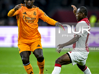 Real Madrid CF legend Clarence Seedorf and AFC Ajax Amsterdam legend Eyong Enoh participate in the match between Ajax Legends and Real Madri...