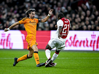 Real Madrid CF legend player Jose Amavisca and AFC Ajax Amsterdam legend player Eyong Enoh participate in the match between Ajax Legends and...