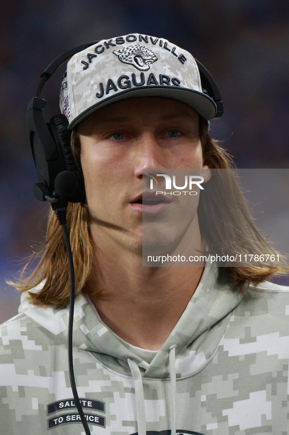 DETROIT,MICHIGAN-November 17: Jacksonville Jaguars quarterback Trevor Lawrence (16) looks on from the sideline during the first half of an N...