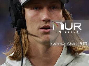 DETROIT,MICHIGAN-November 17: Jacksonville Jaguars quarterback Trevor Lawrence (16) looks on from the sideline during the first half of an N...