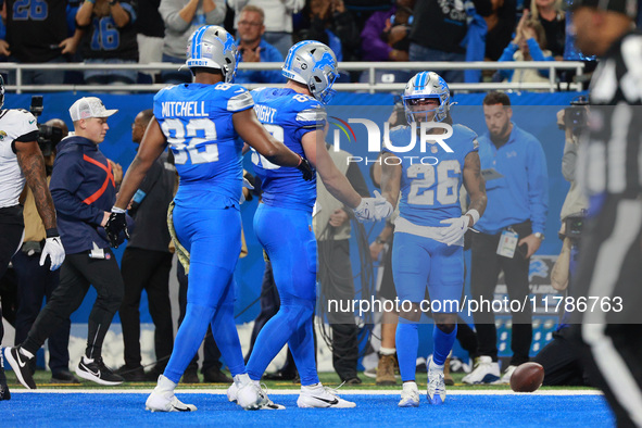 DETROIT,MICHIGAN-November 17: Detroit Lions running back Jahmyr Gibbs (26) scoresd a touchdown during the first half of an NFL football game...