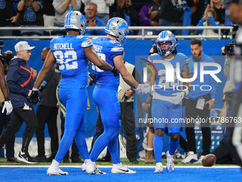 DETROIT,MICHIGAN-November 17: Detroit Lions running back Jahmyr Gibbs (26) scoresd a touchdown during the first half of an NFL football game...