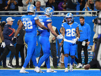 DETROIT,MICHIGAN-November 17: Detroit Lions running back Jahmyr Gibbs (26) scoresd a touchdown during the first half of an NFL football game...