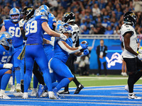 DETROIT,MICHIGAN-November 17: Detroit Lions running back David Montgomery (5) scores a touchdown during the first half of an NFL football ga...