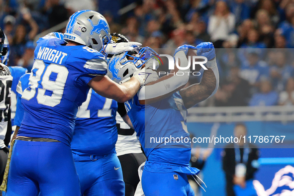 DETROIT,MICHIGAN-November 17: Detroit Lions running back David Montgomery (5) scores a touchdown during the first half of an NFL football ga...