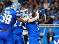 DETROIT,MICHIGAN-November 17: Detroit Lions running back David Montgomery (5) scores a touchdown during the first half of an NFL football ga...