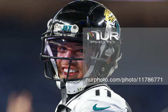 DETROIT,MICHIGAN-NOVEMBER17: Wide receiver Parker Washington (11) of the Jacksonville Jaguars warms up ahead of a game between the Detroit L...