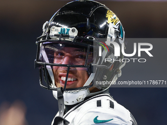 DETROIT,MICHIGAN-NOVEMBER17: Wide receiver Parker Washington (11) of the Jacksonville Jaguars warms up ahead of a game between the Detroit L...