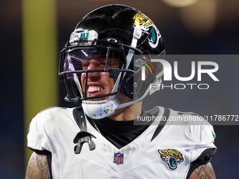 DETROIT,MICHIGAN-NOVEMBER17: Wide receiver Parker Washington (11) of the Jacksonville Jaguars warms up ahead of a game between the Detroit L...