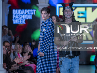 Hungarian designer and organizer Kenguru concludes the event at Budapest Fashion Week in Budapest, Hungary, on November 15, 2024, at the Hal...