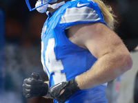 DETROIT,MICHIGAN-NOVEMBER17: Linebacker Alex Anzalone (34) of the Detroit Lions enters the field at the start of  a game between the Detroit...