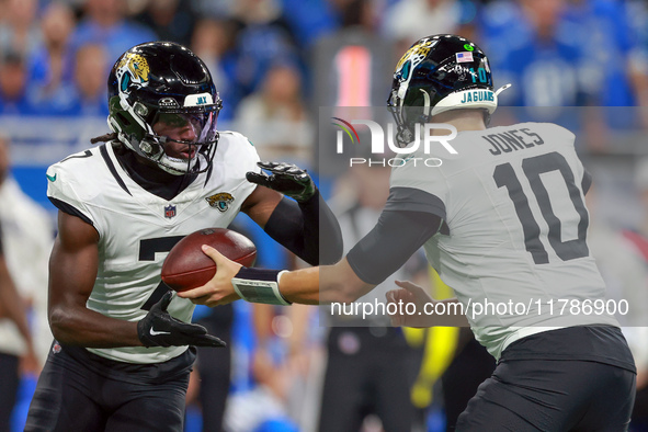 DETROIT,MICHIGAN-NOVEMBER17:  Wide receiver Brian Thomas Jr. (7) of the Jacksonville Jaguars takes the handoff from quarterback Mac Jones (1...