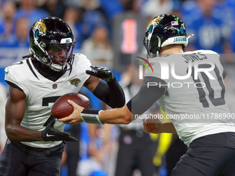 DETROIT,MICHIGAN-NOVEMBER17:  Wide receiver Brian Thomas Jr. (7) of the Jacksonville Jaguars takes the handoff from quarterback Mac Jones (1...