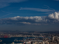 Israeli warplanes leave contrails in the sky above Haifa, Israel, on November 17, 2024. (