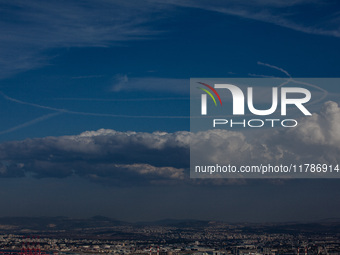 Israeli warplanes leave contrails in the sky above Haifa, Israel, on November 17, 2024. (