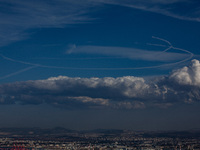 Israeli warplanes leave contrails in the sky above Haifa, Israel, on November 17, 2024. (