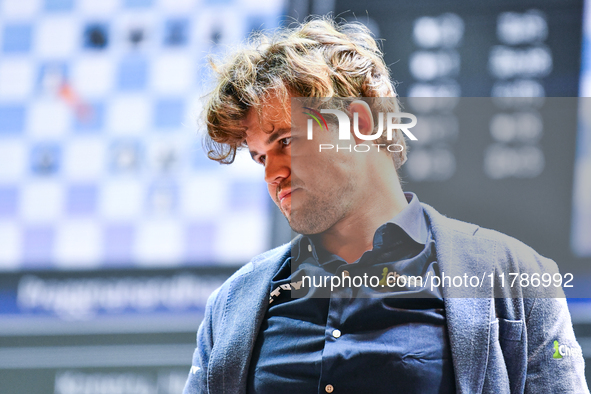 Norwegian GM Magnus Carlsen plays chess during the 6th TATA Steel Chess India Tournament at Dhono Dhanyo Auditorium in Kolkata, India, on No...