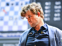 Norwegian GM Magnus Carlsen plays chess during the 6th TATA Steel Chess India Tournament at Dhono Dhanyo Auditorium in Kolkata, India, on No...