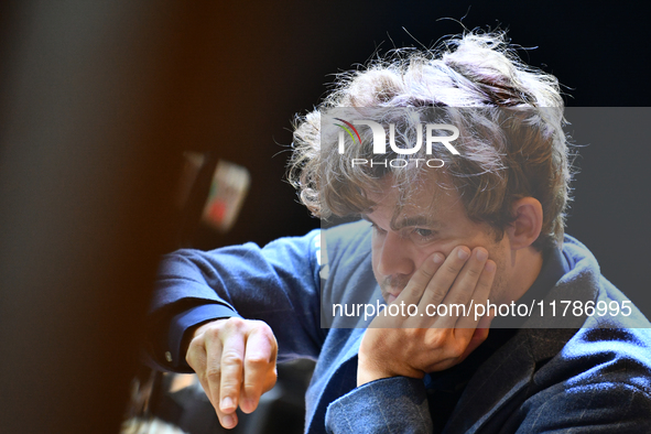 Norwegian GM Magnus Carlsen plays chess during the 6th TATA Steel Chess India Tournament at Dhono Dhanyo Auditorium in Kolkata, India, on No...