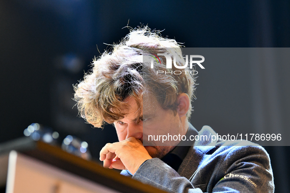 Norwegian GM Magnus Carlsen plays chess during the 6th TATA Steel Chess India Tournament at Dhono Dhanyo Auditorium in Kolkata, India, on No...