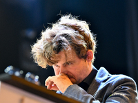 Norwegian GM Magnus Carlsen plays chess during the 6th TATA Steel Chess India Tournament at Dhono Dhanyo Auditorium in Kolkata, India, on No...