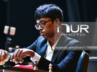 Indian GM Rameshbabu Praggnanandhaa plays chess during the 6th TATA Steel Chess India Tournament at Dhono Dhanyo Auditorium in Kolkata, Indi...