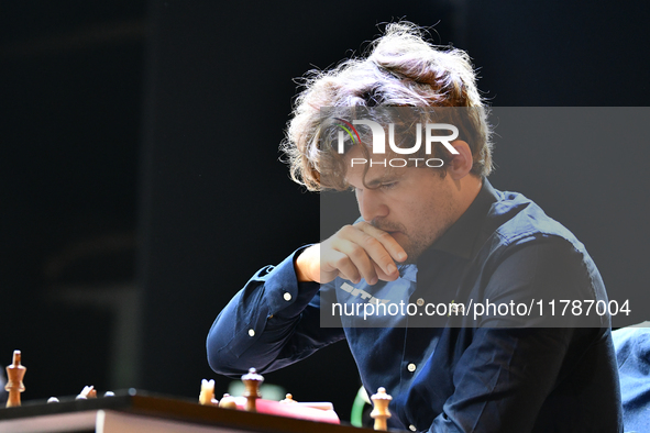 Norwegian GM Magnus Carlsen plays chess during the 6th TATA Steel Chess India Tournament at Dhono Dhanyo Auditorium in Kolkata, India, on No...