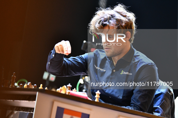 Norwegian GM Magnus Carlsen plays chess during the 6th TATA Steel Chess India Tournament at Dhono Dhanyo Auditorium in Kolkata, India, on No...