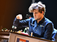 Norwegian GM Magnus Carlsen plays chess during the 6th TATA Steel Chess India Tournament at Dhono Dhanyo Auditorium in Kolkata, India, on No...